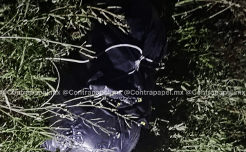 Hallan una cabeza y cuatro bolsas con restos humanos en poblado de Texcoco